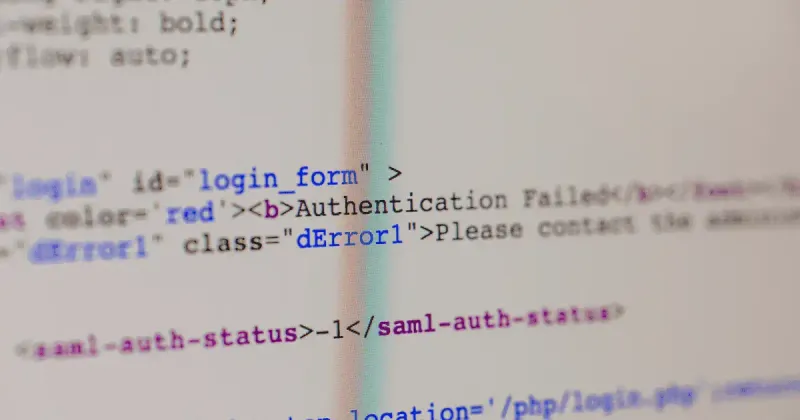Picture of a computer screen showing HTML code to represent I.T work.